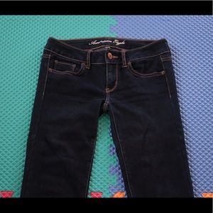 American eagle dark blue jeans.